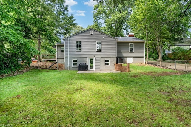 1420 Rankin Rd, Greensboro, NC 27405 - rear view of house with a chimney and a patio