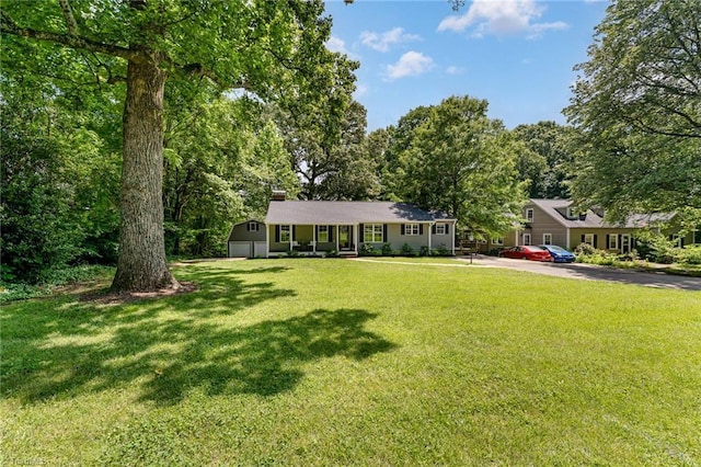 1420 Rankin Rd, Greensboro, NC 27405 - ranch-style home featuring asphalt driveway, a chimney, and a front yard