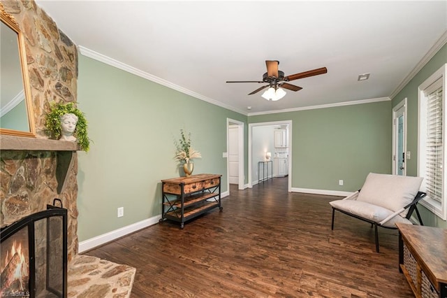 1420 Rankin Rd, Greensboro, NC 27405 - sitting room with wood finished floors, a ceiling fan, crown molding, and a stone fireplace