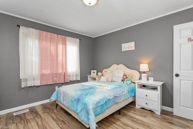 415 Crestview Dr, Thomasville, NC 27360 - bedroom with wood finished floors and ornamental molding