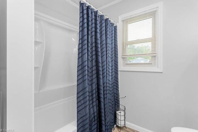 415 Crestview Dr, Thomasville, NC 27360 - bathroom featuring crown molding, wood finished floors, and shower / tub combo with curtain