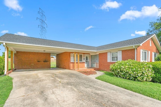 415 Crestview Dr, Thomasville, NC 27360 - ranch-style house with brick siding, concrete driveway, and a carport