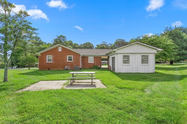 415 Crestview Dr, Thomasville, NC 27360 - back of property with a lawn, board and batten siding, and a patio