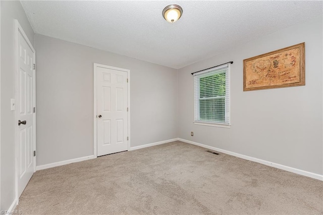 1018 Sequoia Dr, Lewisville, NC 27023 - unfurnished bedroom featuring carpet and a textured ceiling