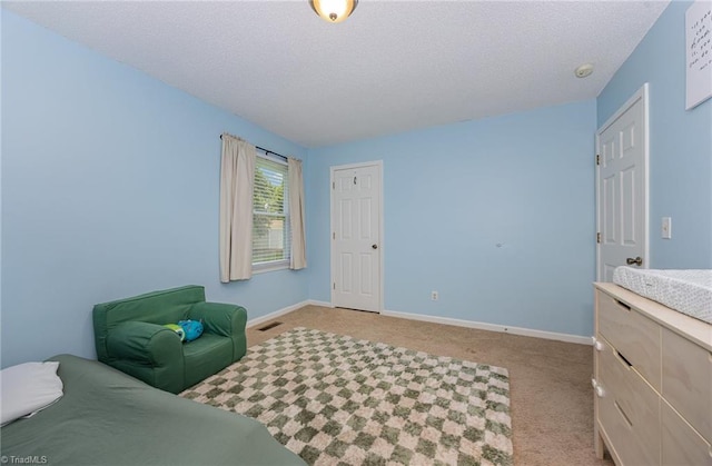 1018 Sequoia Dr, Lewisville, NC 27023 - bedroom featuring carpet and a textured ceiling
