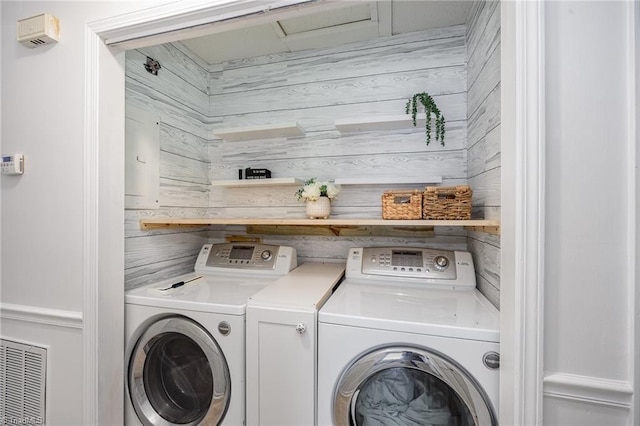 1018 Sequoia Dr, Lewisville, NC 27023 - laundry area with separate washer and dryer and wood walls