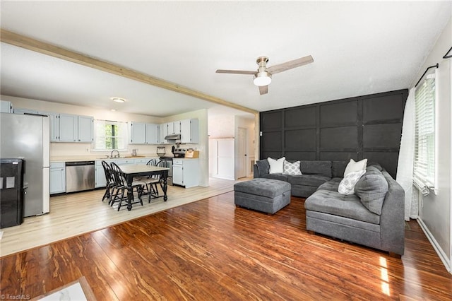 1018 Sequoia Dr, Lewisville, NC 27023 - living area with a decorative wall, light wood-type flooring, and a ceiling fan