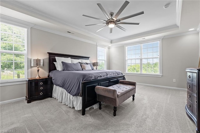 4420 Bonnie Loch Dr, Burlington, NC 27215 - bedroom featuring a tray ceiling, multiple windows, baseboards, ornamental molding, and light colored carpet