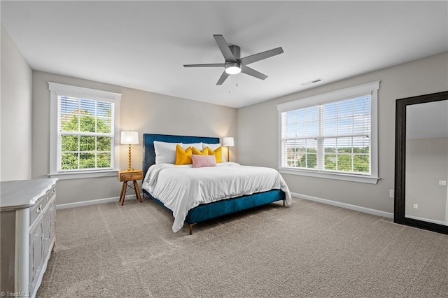 4420 Bonnie Loch Dr, Burlington, NC 27215 - bedroom with baseboards, light carpet, and a ceiling fan