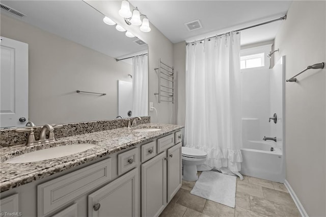 4420 Bonnie Loch Dr, Burlington, NC 27215 - bathroom with toilet, shower / tub combo with curtain, double vanity, and baseboards