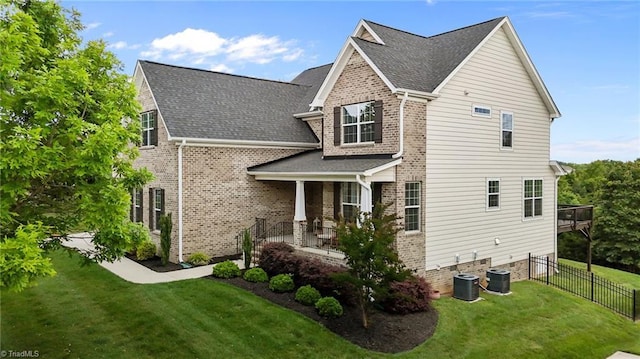 4420 Bonnie Loch Dr, Burlington, NC 27215 - view of home's exterior featuring brick siding, covered porch, central air condition unit, and a shingled roof
