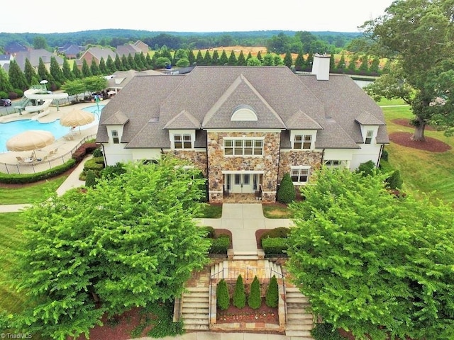 4420 Bonnie Loch Dr, Burlington, NC 27215 - view of front facade with stone siding, stairs, and a chimney