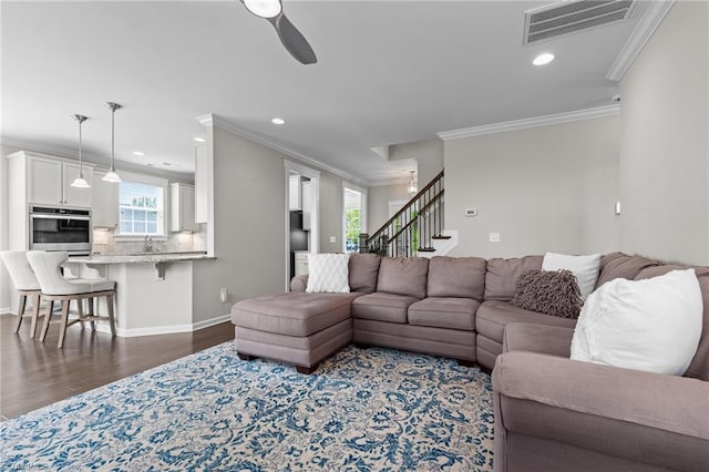 4420 Bonnie Loch Dr, Burlington, NC 27215 - living area featuring ornamental molding, a ceiling fan, dark wood-style flooring, stairway, and recessed lighting