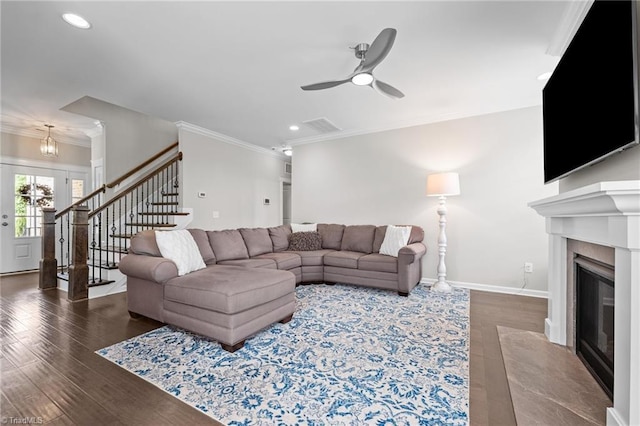 4420 Bonnie Loch Dr, Burlington, NC 27215 - living room with crown molding, a premium fireplace, stairway, ceiling fan, and wood finished floors