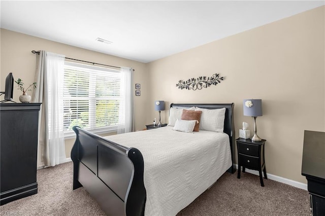 carpeted bedroom with baseboards