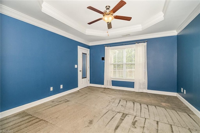 5207 York Place Ct, Walkertown, NC 27051 - carpeted empty room featuring a tray ceiling, a ceiling fan, and crown molding