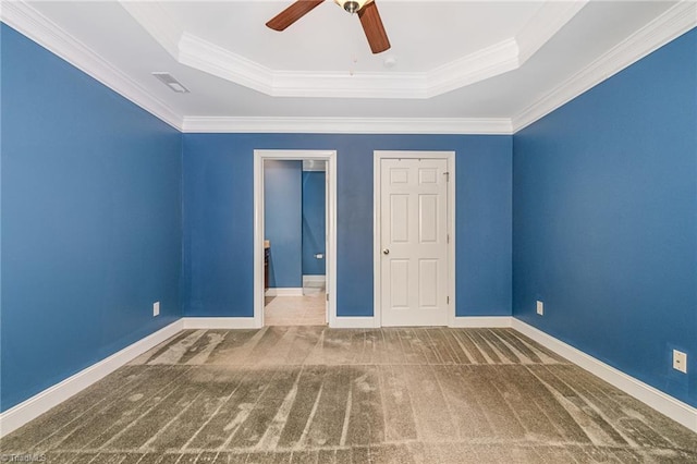 5207 York Place Ct, Walkertown, NC 27051 - spare room with a tray ceiling, a ceiling fan, carpet floors, and ornamental molding