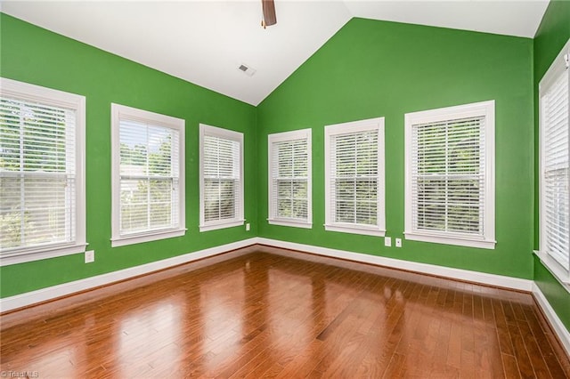5207 York Place Ct, Walkertown, NC 27051 - empty room featuring lofted ceiling and wood finished floors