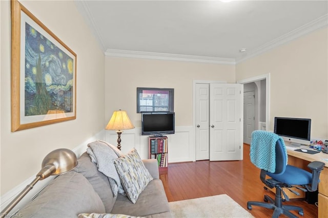 office area with hardwood / wood-style floors and crown molding