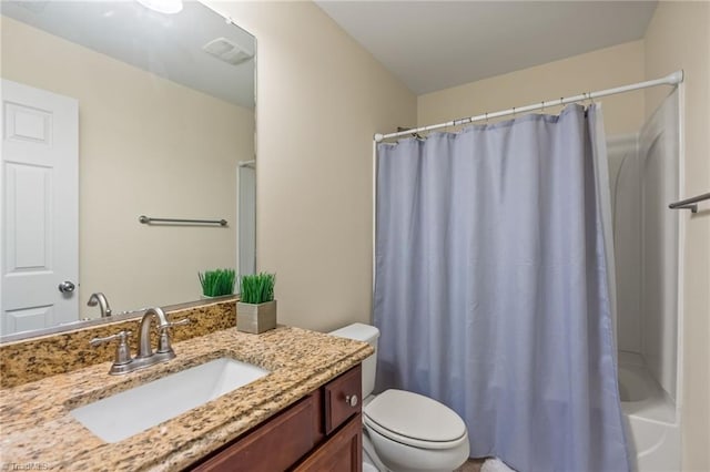 full bathroom featuring shower / bath combo, vanity, and toilet