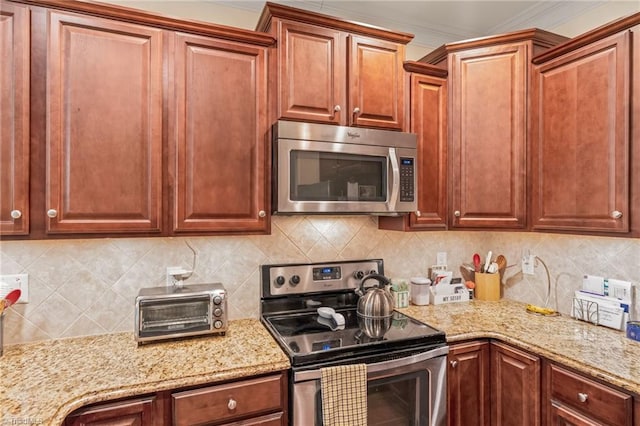 kitchen featuring decorative backsplash, appliances with stainless steel finishes, and crown molding