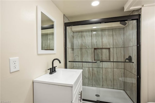 full bath featuring a shower stall, vanity, and recessed lighting