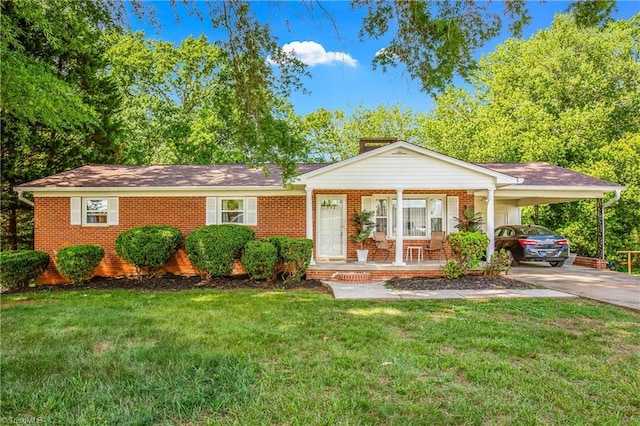 ranch-style house with covered porch, brick siding, concrete driveway, and a front yard