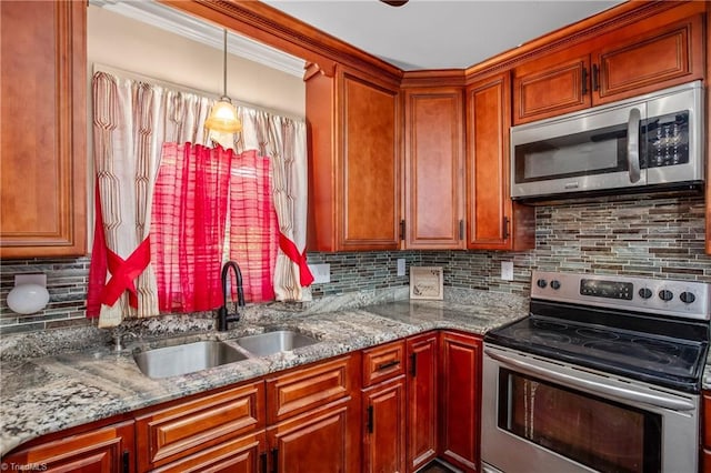 kitchen with stainless steel appliances, a sink, light stone countertops, backsplash, and crown molding