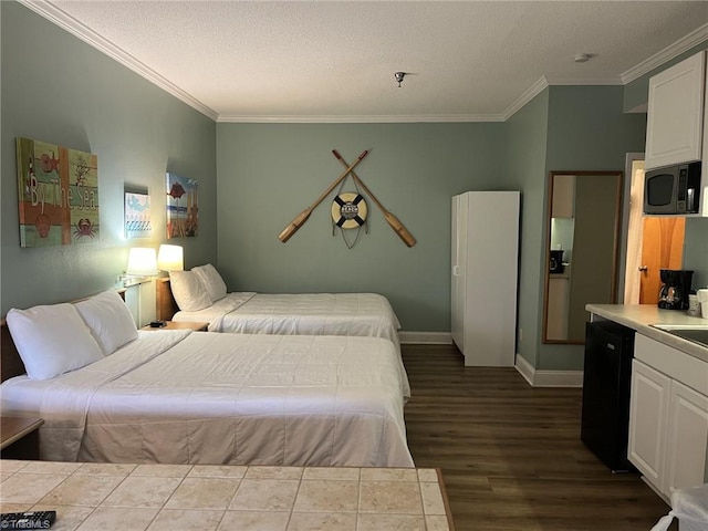 602 Fort Macon Rd, Atlantic Beach, NC 28512 - bedroom with ornamental molding, a textured ceiling, dark wood-style floors, a sink, and baseboards
