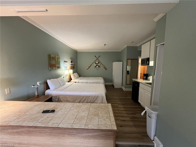 bedroom with ornamental molding and dark hardwood / wood-style flooring