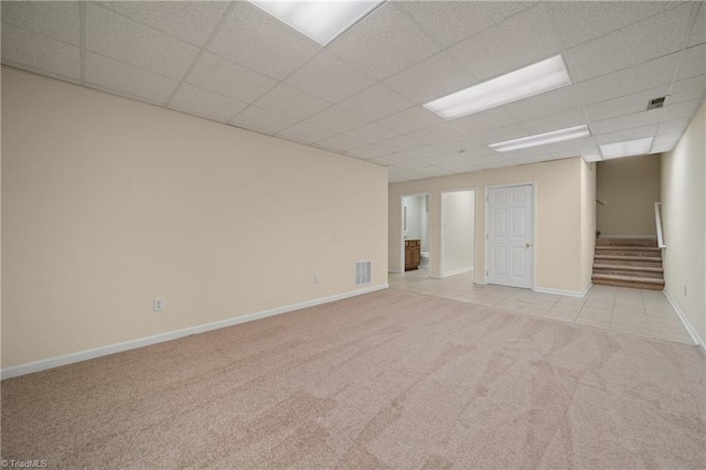 4028 Lofter Ct, Pfafftown, NC 27040 - carpeted spare room featuring stairs and a paneled ceiling