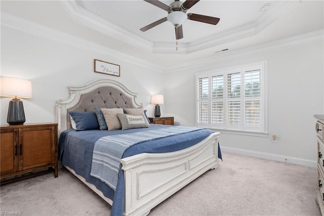 carpeted bedroom with ornamental molding, a raised ceiling, and ceiling fan