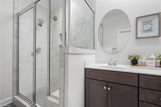 bathroom featuring walk in shower, ornamental molding, and vanity