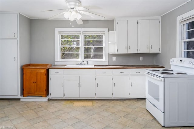 kitchen featuring white cabinets, electric range, ceiling fan, and sink