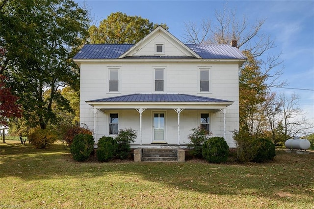 view of front of house featuring covered porch and a front yard