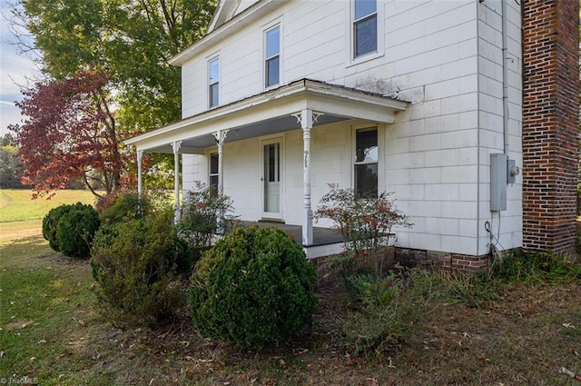 view of exterior entry with a porch