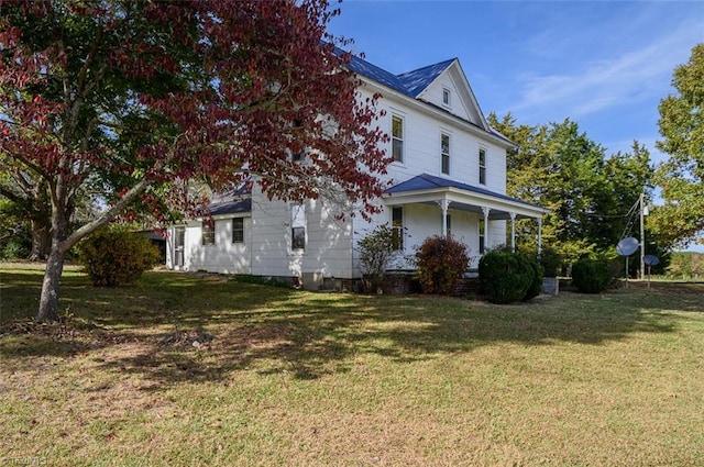 view of home's exterior with a lawn