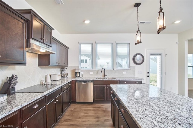 kitchen featuring pendant lighting, dishwasher, dark brown cabinetry, and sink