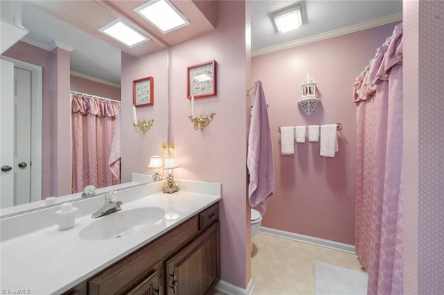 bathroom featuring ornamental molding, tile patterned floors, vanity, and toilet