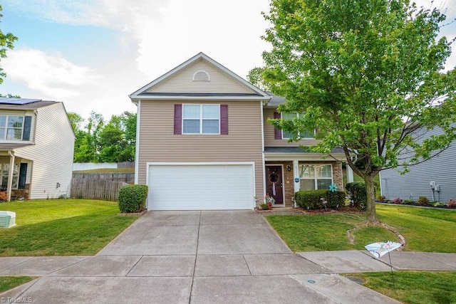 traditional home with a garage, driveway, a front lawn, and fence