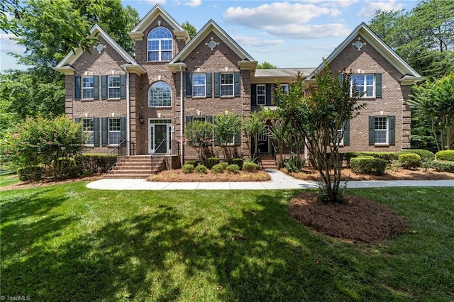 craftsman-style home with a front yard