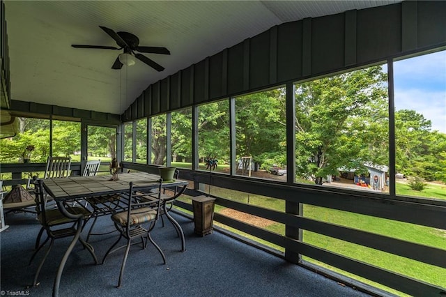 unfurnished sunroom featuring plenty of natural light, ceiling fan, and vaulted ceiling