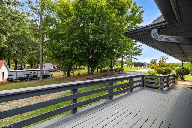 wooden deck with a yard