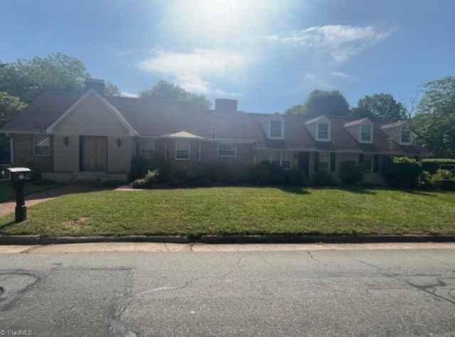 view of front of home with a front yard