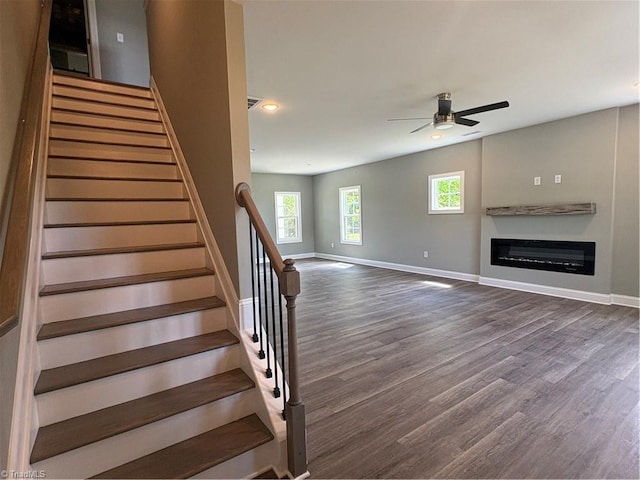 7376 Ridge Rd, Winston-Salem, NC 27107 - stairs with a ceiling fan, baseboards, and wood finished floors
