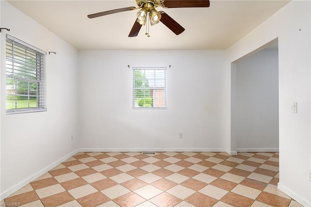1309 Jackson St, Burlington, NC 27217 - spare room featuring ceiling fan and baseboards