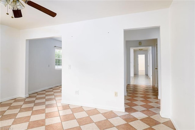 1309 Jackson St, Burlington, NC 27217 - spare room featuring ceiling fan and baseboards