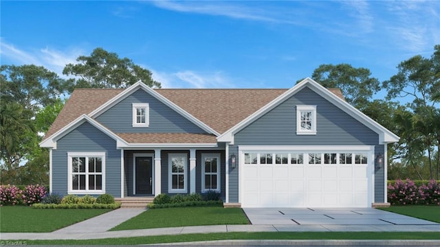 view of front of home with a front yard and a garage