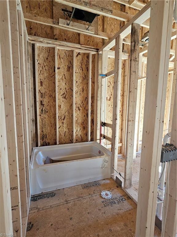 bathroom featuring a washtub