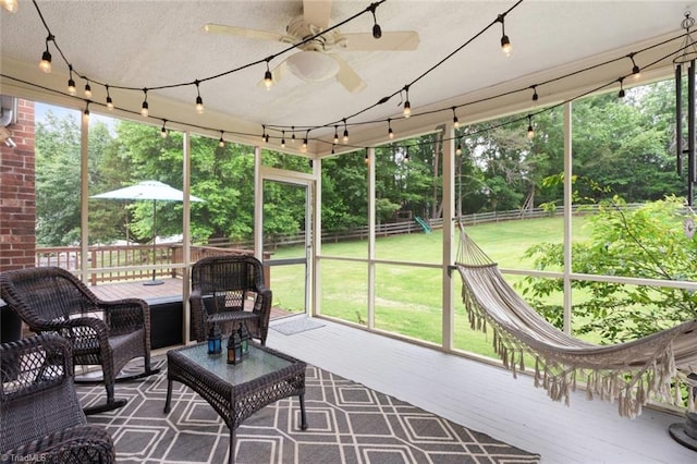 641 Doe Run Dr, Kernersville, NC 27284 - sunroom / solarium featuring ceiling fan and view of wooded area